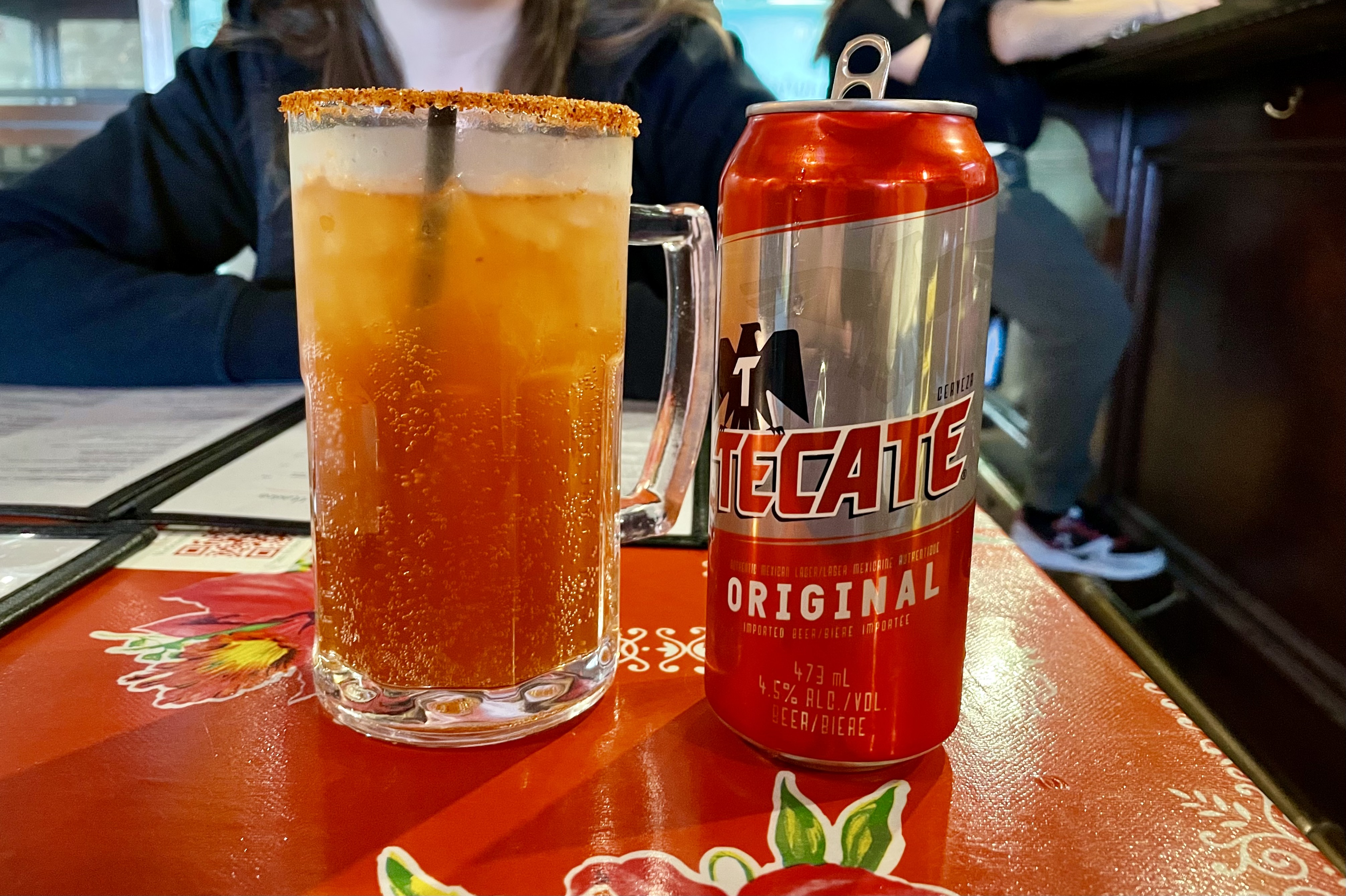 A michelada is a Mexican drink made with beer, lime juice, assorted sauces, spices, and chili peppers, served in a chilled, salt-rimmed glass