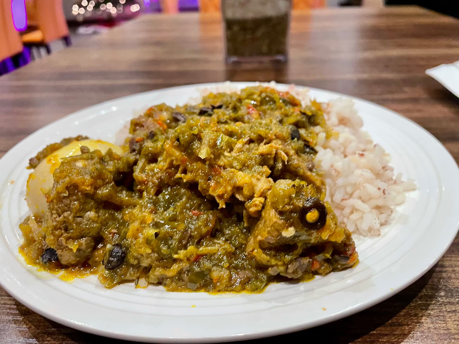 Smoky, fiery, and bursting with flavor, this Nigerian ofada rice—served with tender beef, tripe, and perfectly cooked beans in a nutty palm oil sauce—delivers comfort and heat in every unforgettable bite