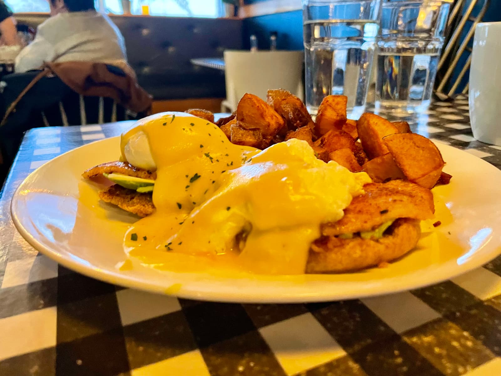 Perfectly poached eggs and warm English muffins at Claudine’s Eatery, the kind of breakfast that keeps people coming back week after week