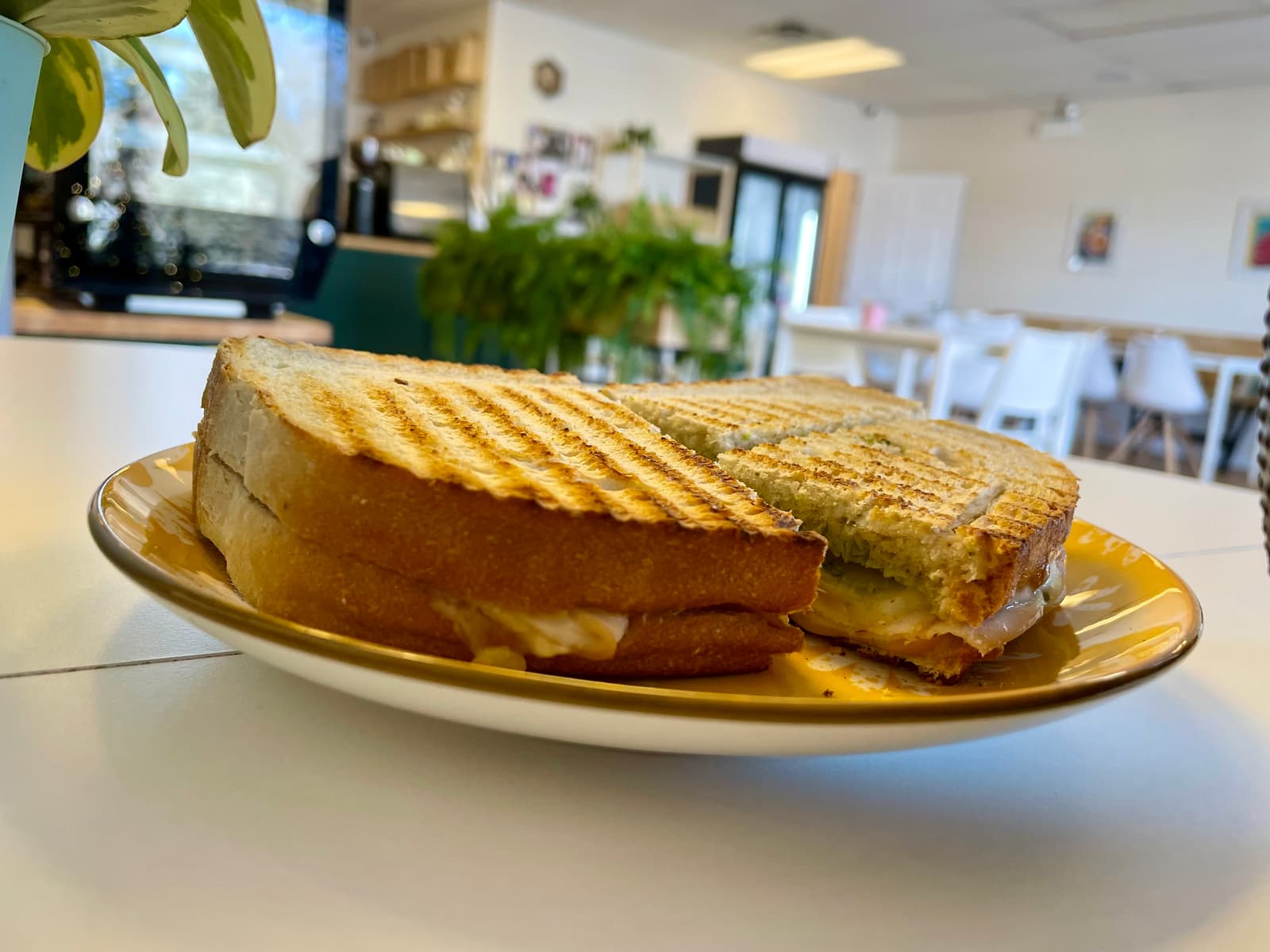 Crispy bread, sharp melted cheese and garlicky fresh basil pesto come together in a simple, satisfying sandwich
