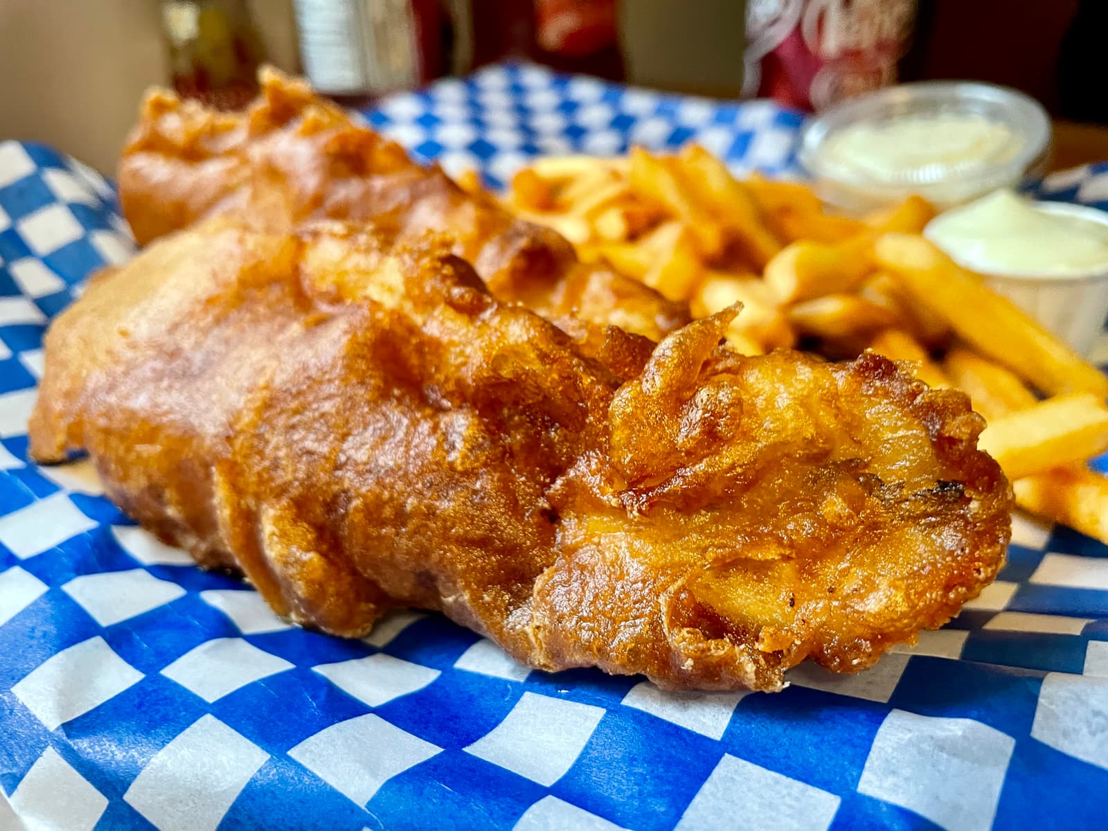 Golden, crisp haddock with a light batter that shatters just enough to give way to tender, flaky fish