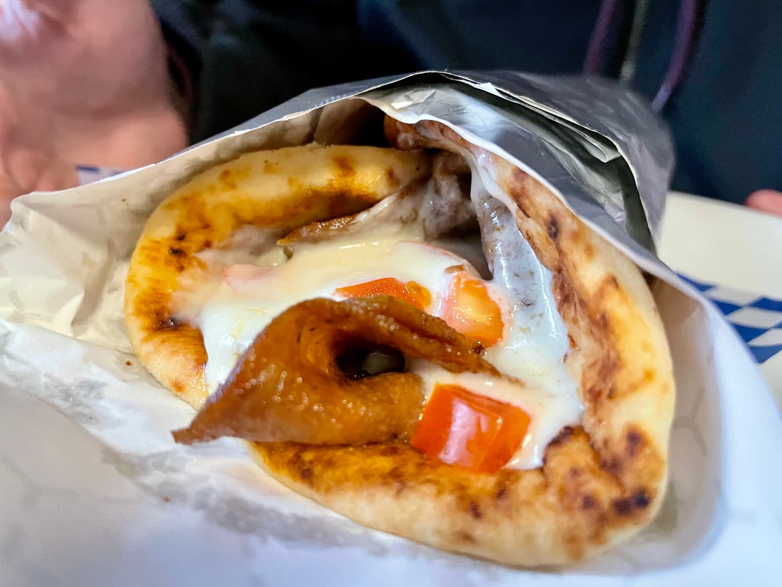 A classic donair, messy in the best way, layered with thin-sliced meat and generous sauce