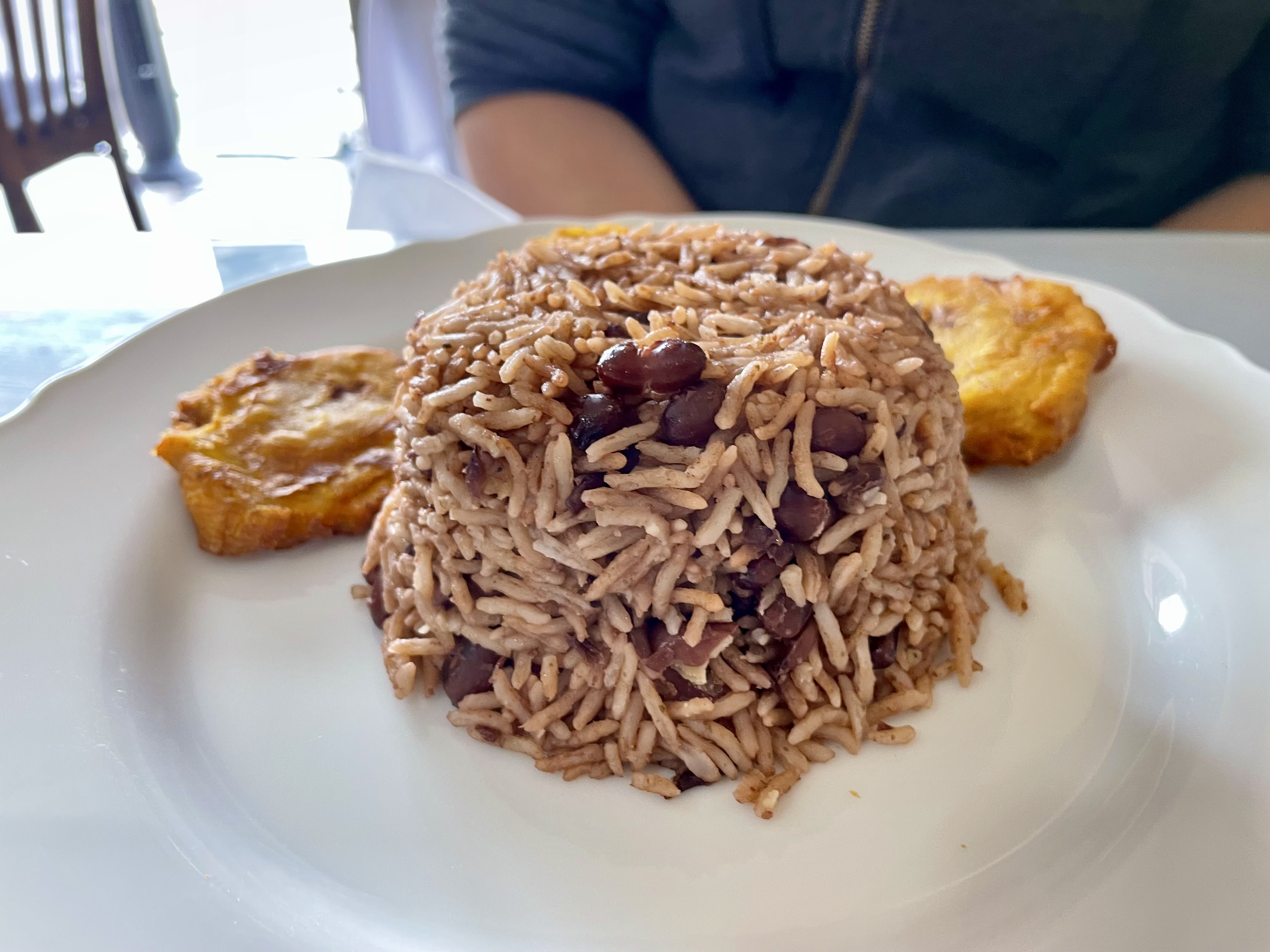 The oxtail came with rice, pinto beans, fried plantains and pikliz