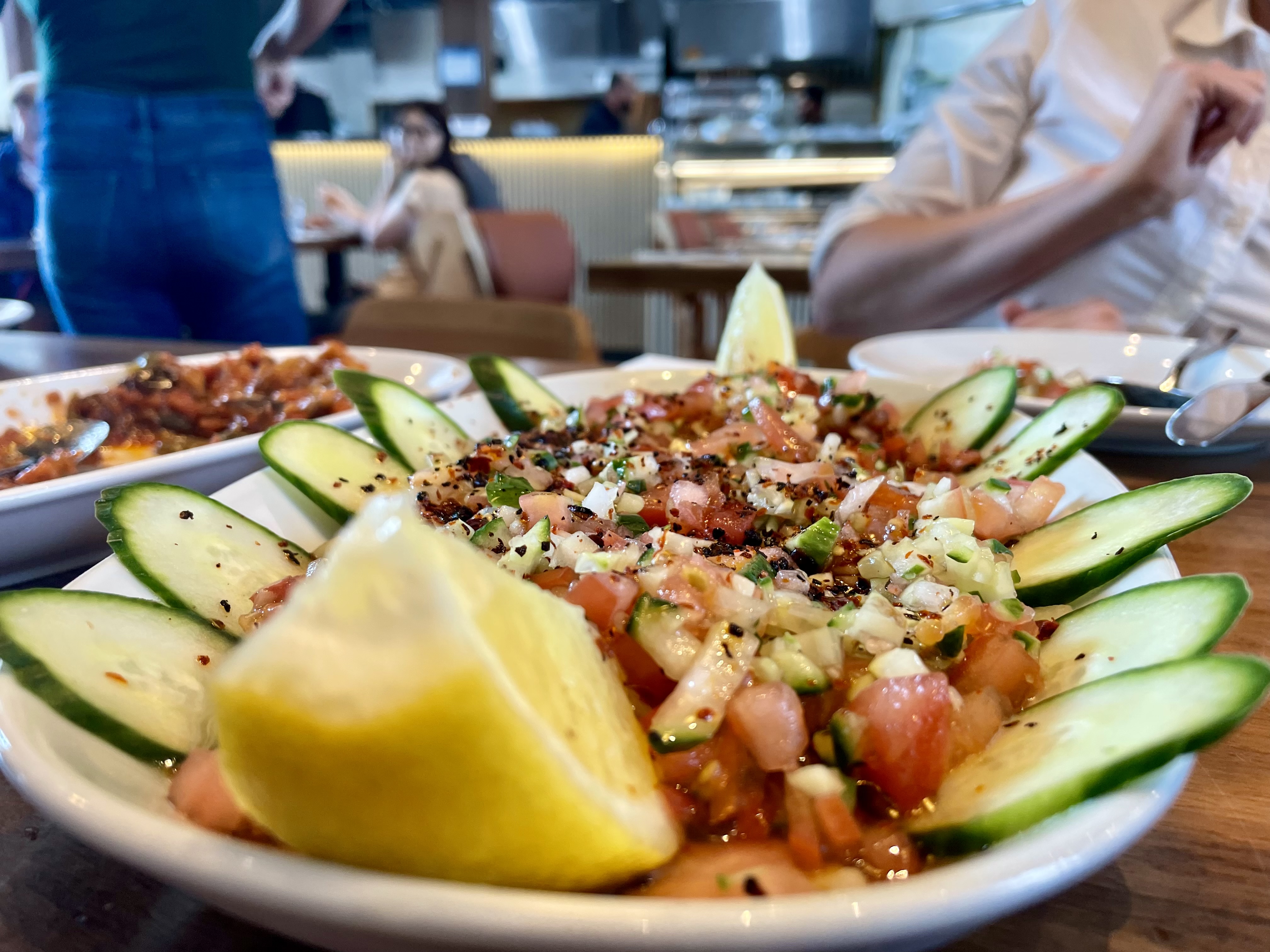 The refreshing kashiq salad comes with tomatoes, cucumber, onion, parsley, salt, lemon juice and pomegranate sauce