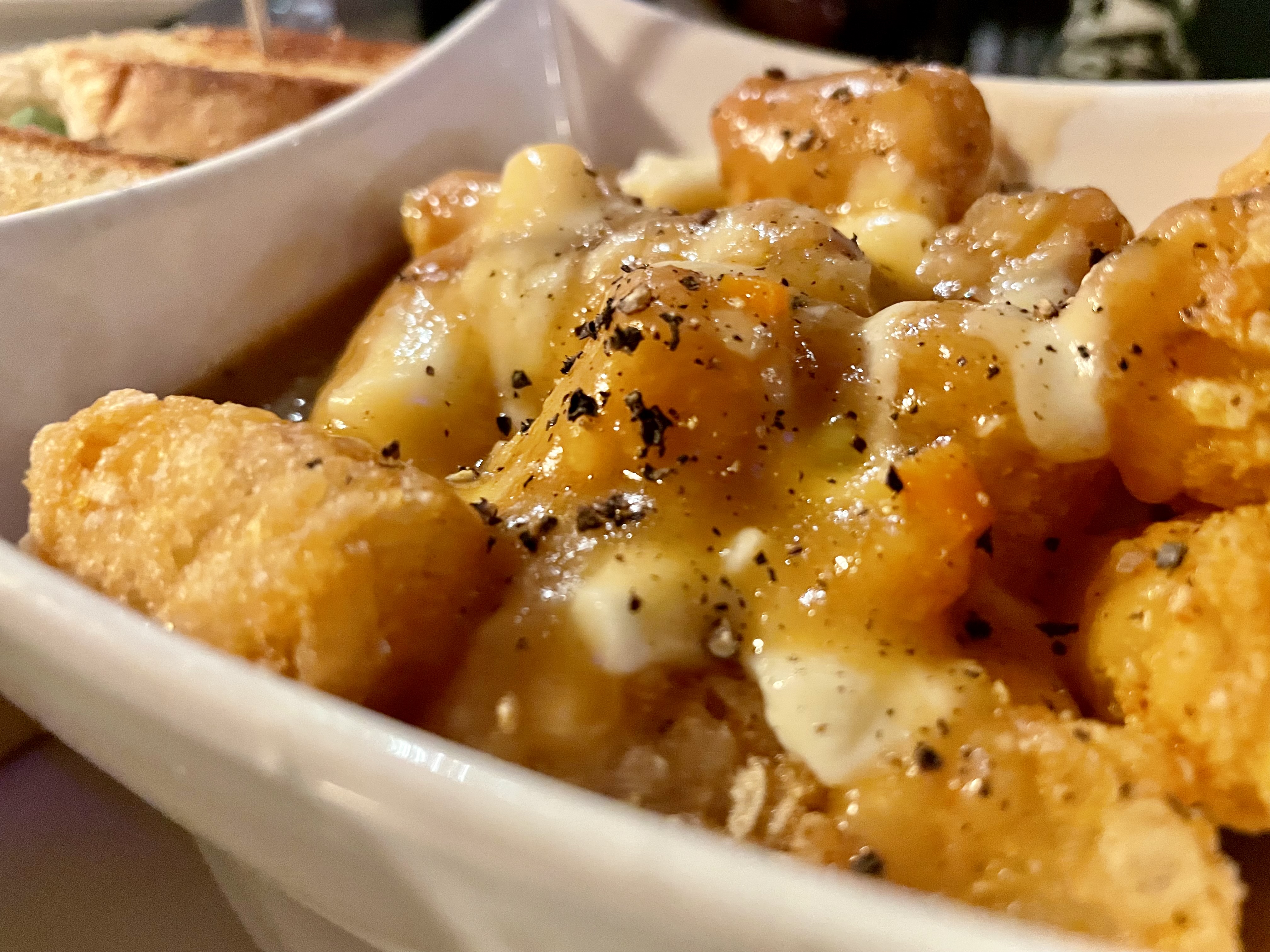 We loved a sprinkling of black pepper on our tater-tot poutine—a side we've been craving since we tried it at Bowman's