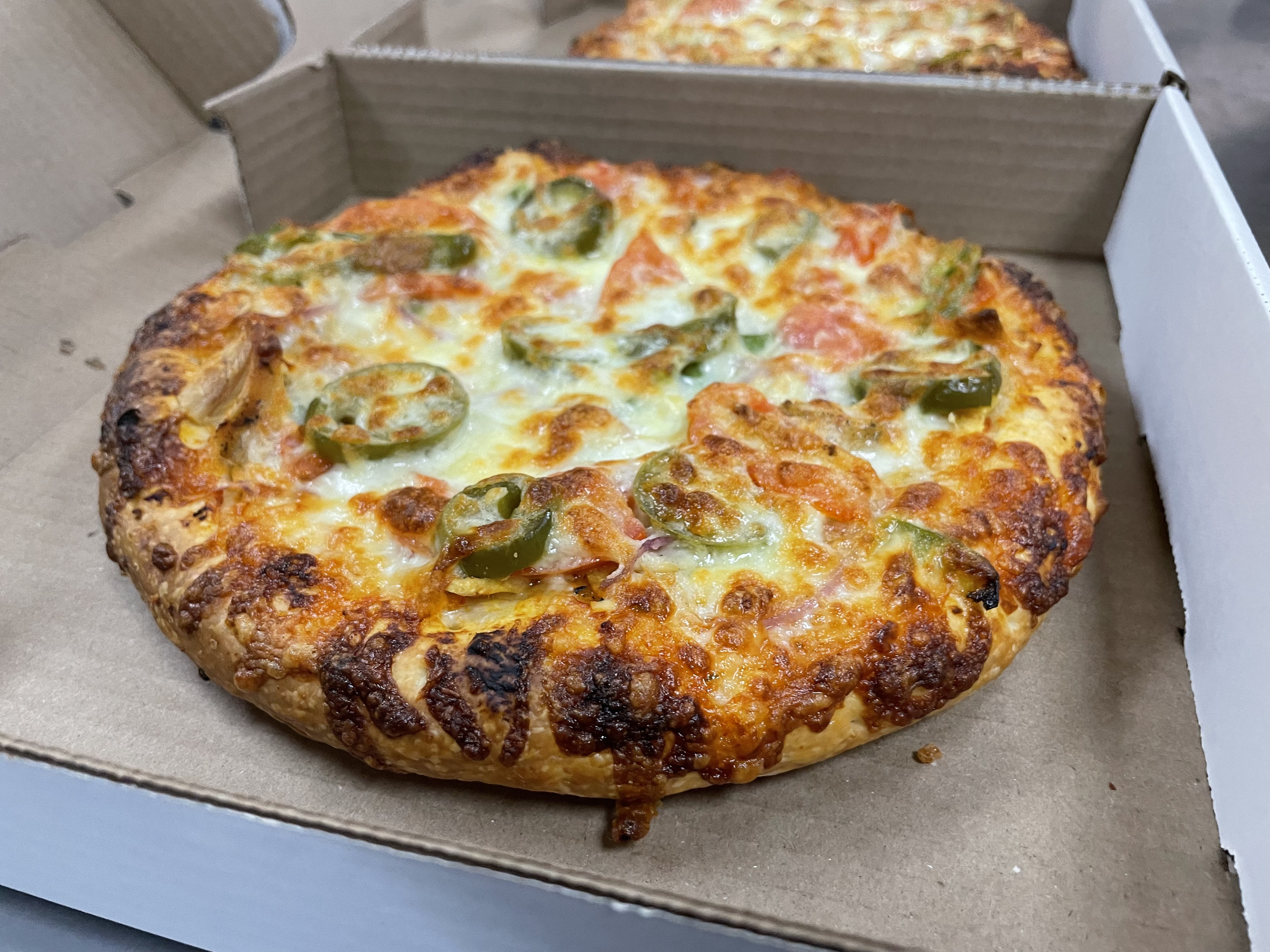 The jalapenos gave our pizza a nice kick, but the owner indicated they can modify the spice level according to custumers' taste