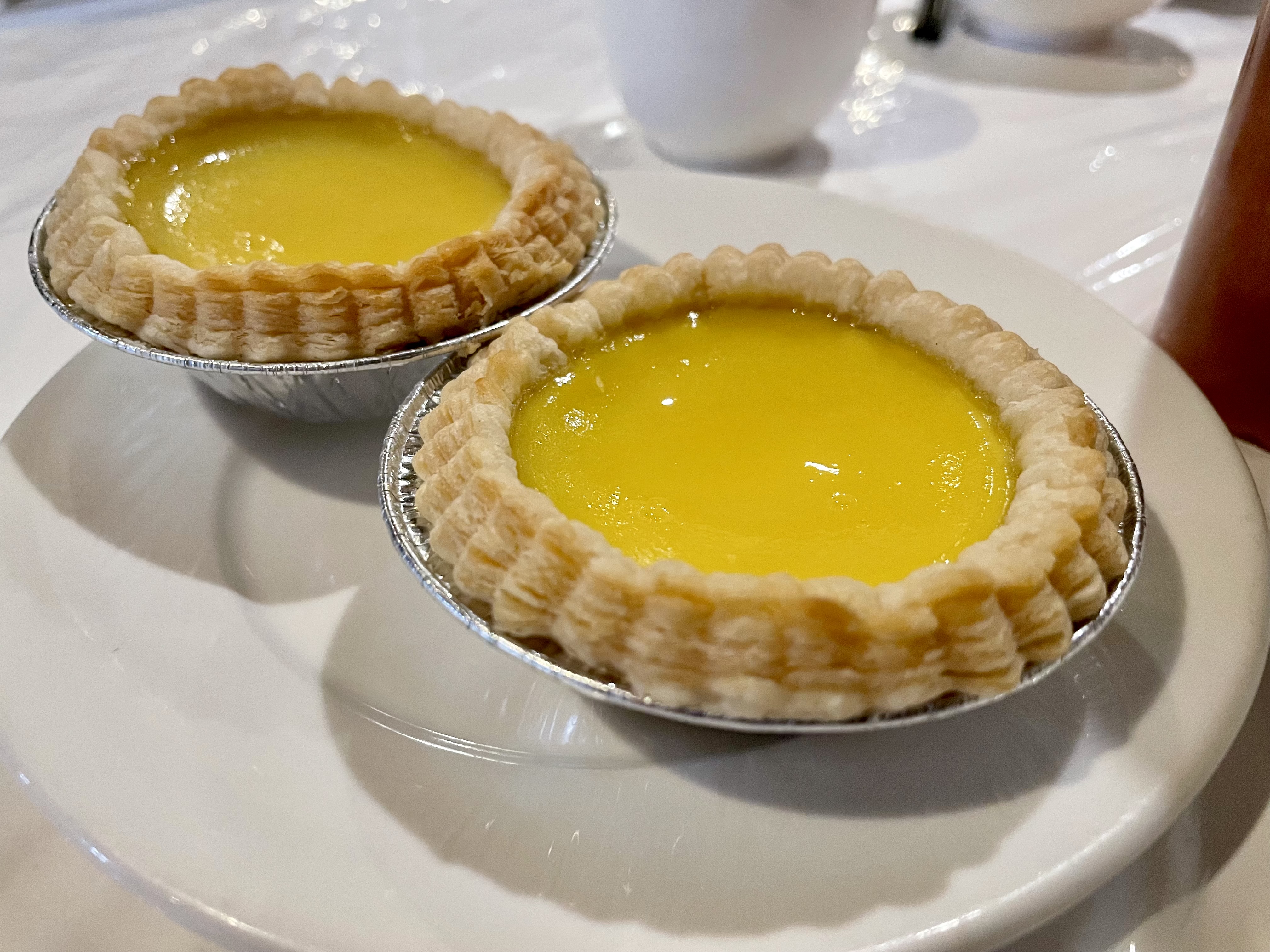 The egg tarts consist of an outer pastry crust filled with egg custard