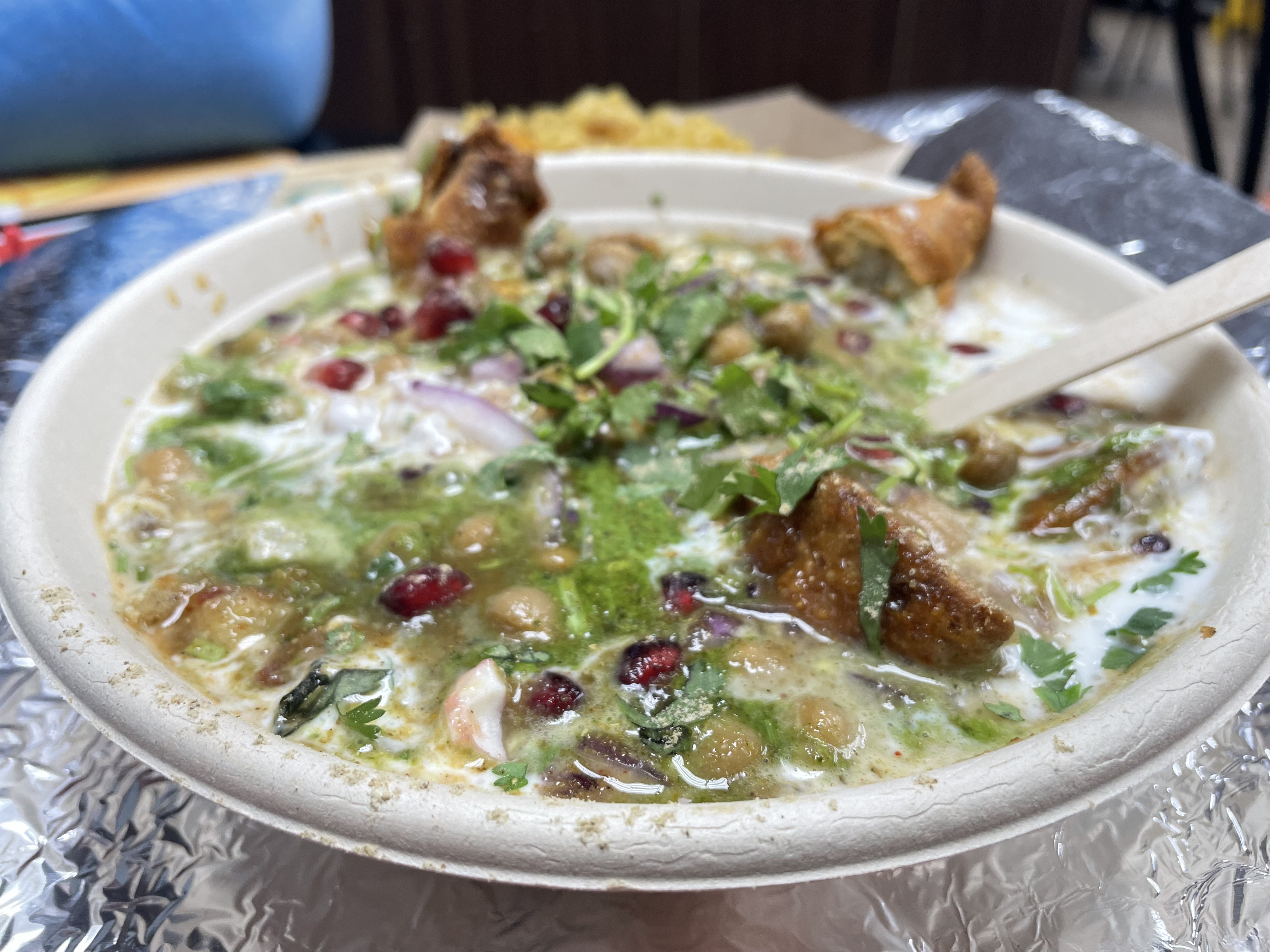 Samosa chaat is a dish made with chickpeas, crispy samosa, assorted sweet and spicy chutneys and crunchy toppings