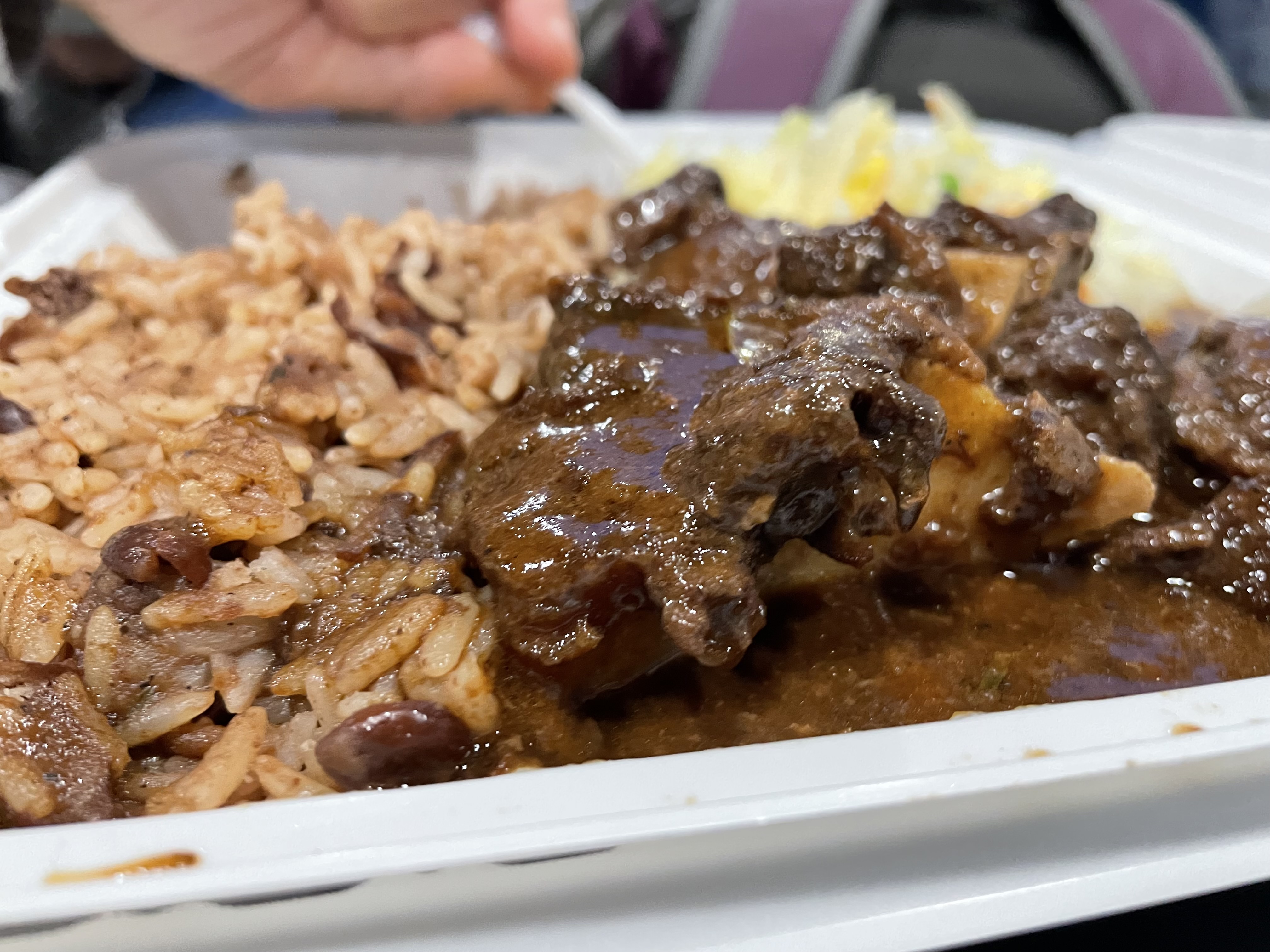 The oxtail comprised of braised beef tails cooked with lima beans seasoned with Fishys' signature spice blend