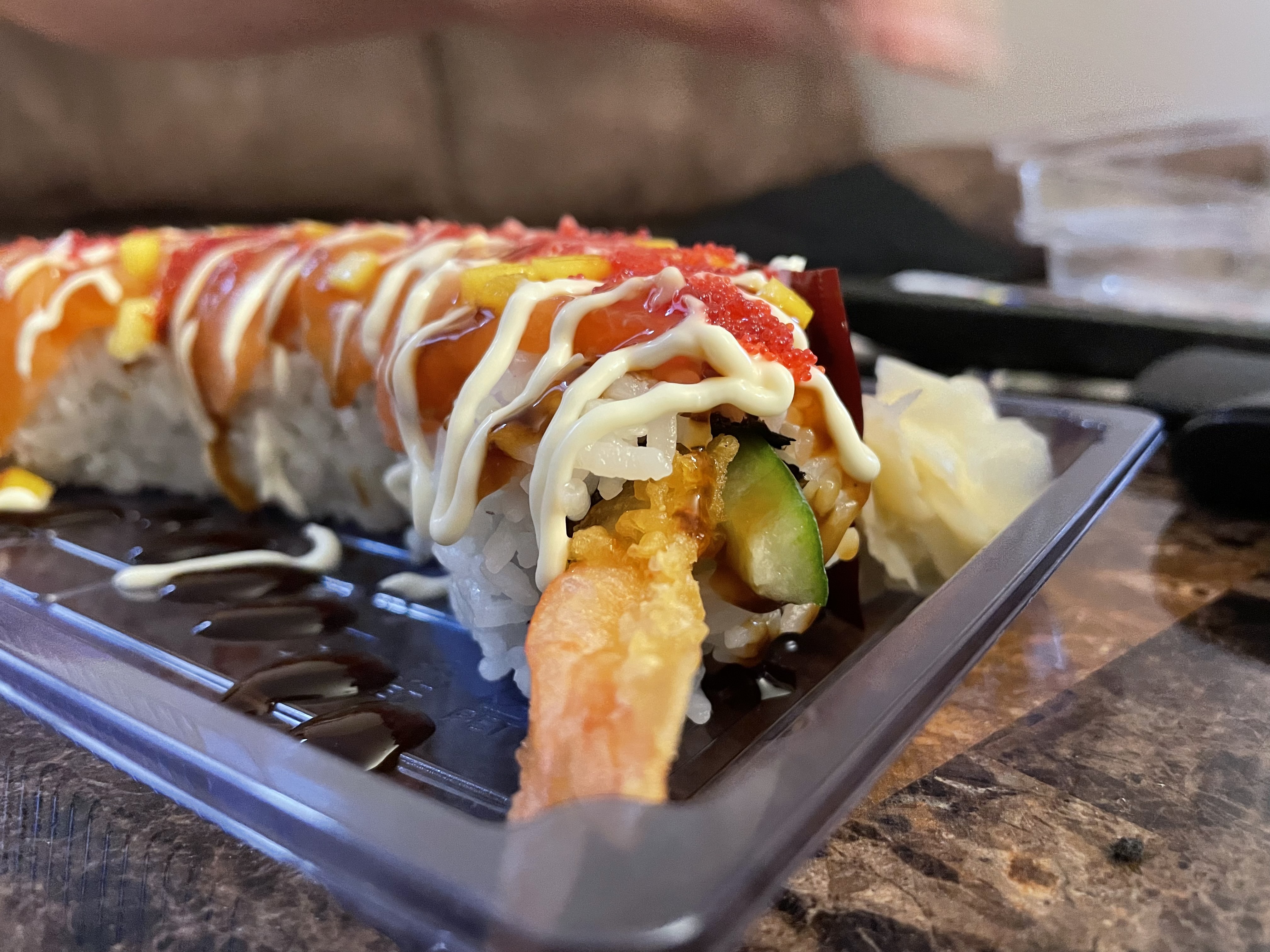 A maki roll is a traditional sushi roll that often consists of fish, vegetables and rice rolled up in seaweed