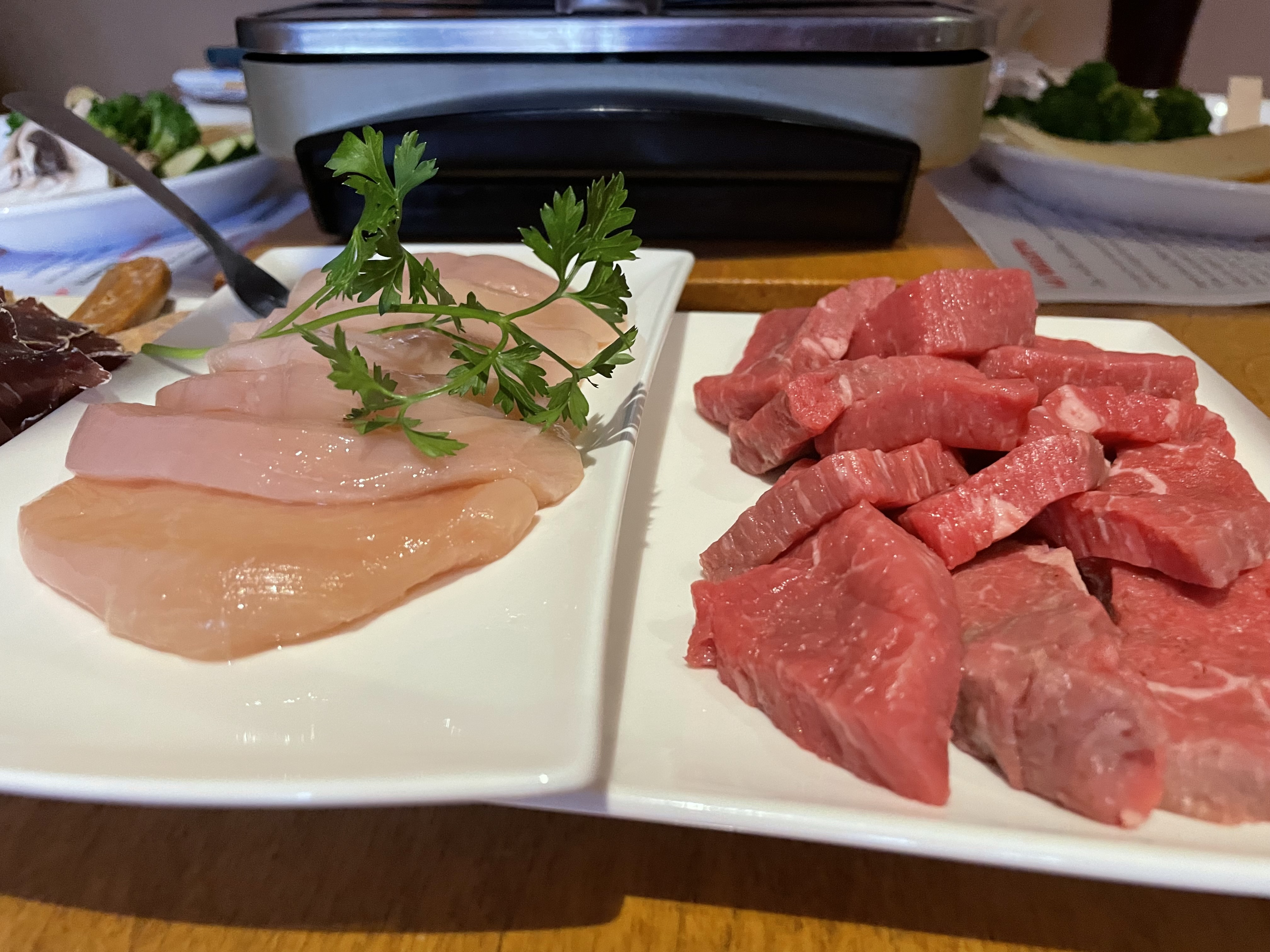 Raclette is like the European version of those familiar with East Asian barbecues where you cook at your own table, except with a lot more cheese involved