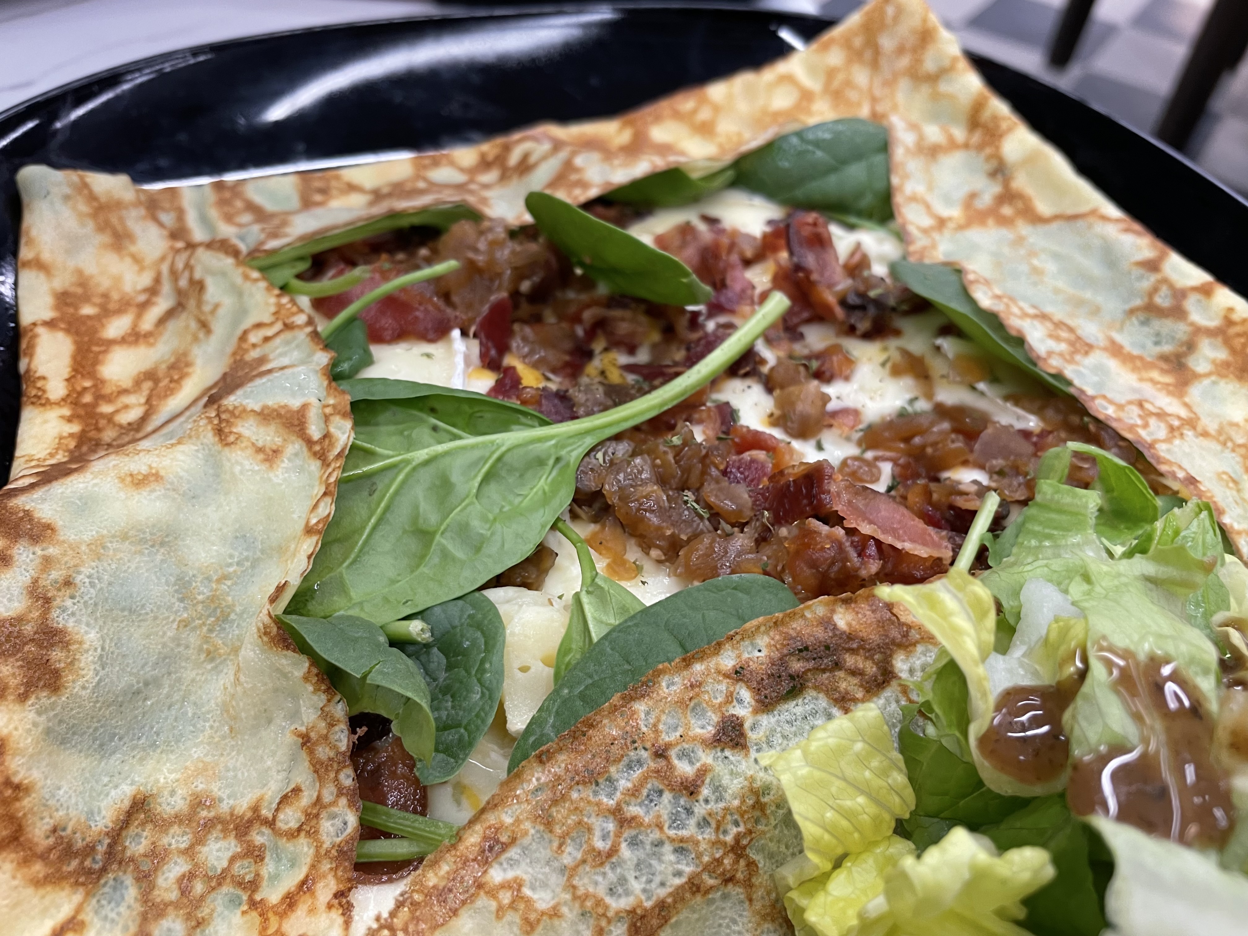 The signature savoury Bretonne crepe came with mozzarella, brie, bacon, caramelized onions and baby spinach