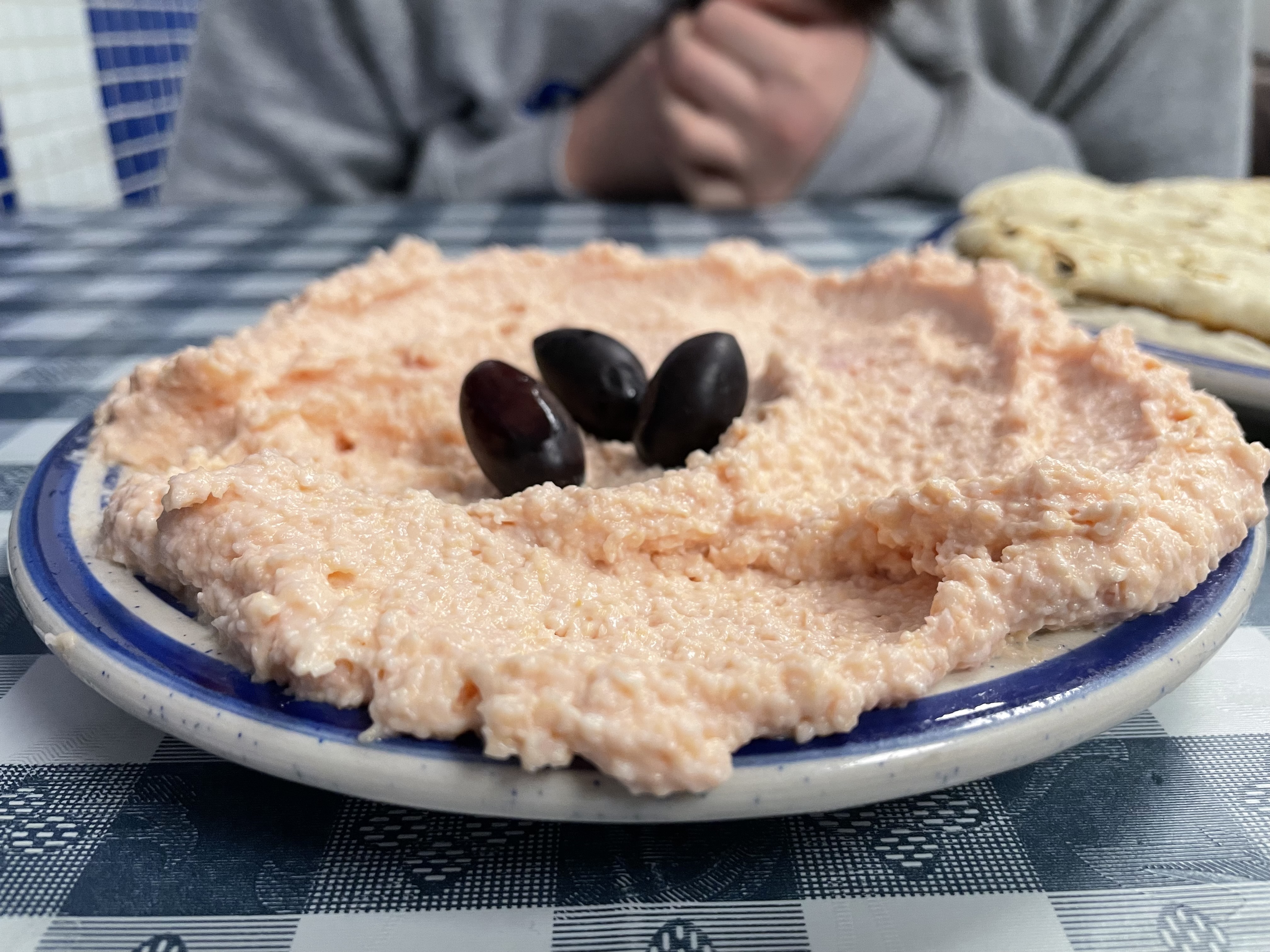 Taramasalata is a creamy, tangy Greek dip made from salted caviar, olive oil, lemon juice, and bread or potato