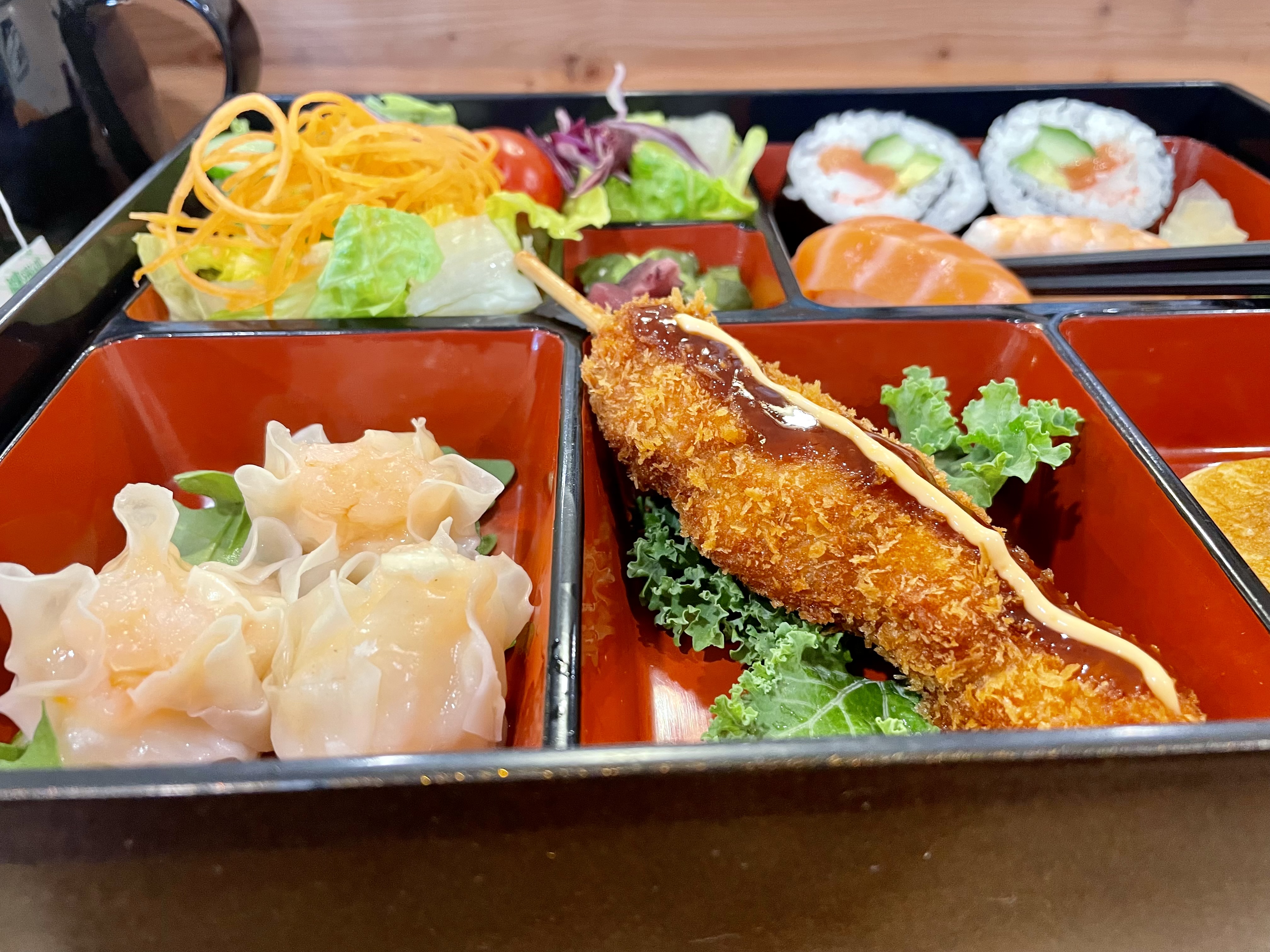 A little bit of everything to please the senses—from shrimp with a delicate, dim sum-inspired filling to fresh maki rolls, chirashi, and a perfectly charred pork skewer, a Shokado bento box that’s as satisfying as it is visually stunning