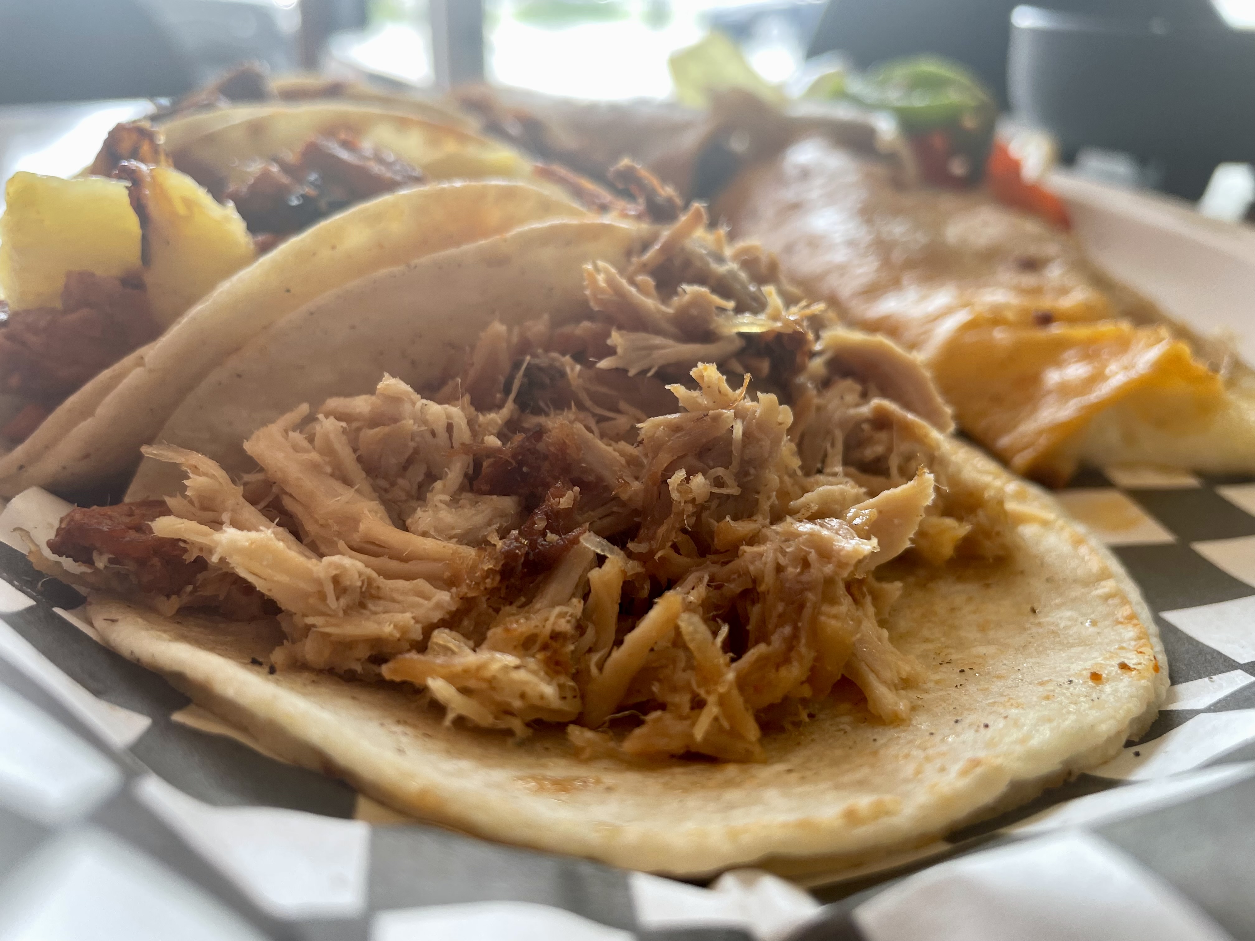 A perfect taco spread: tender pork front and centre, with lengua, barbacoa, chorizo, and al pastor waiting in the wings