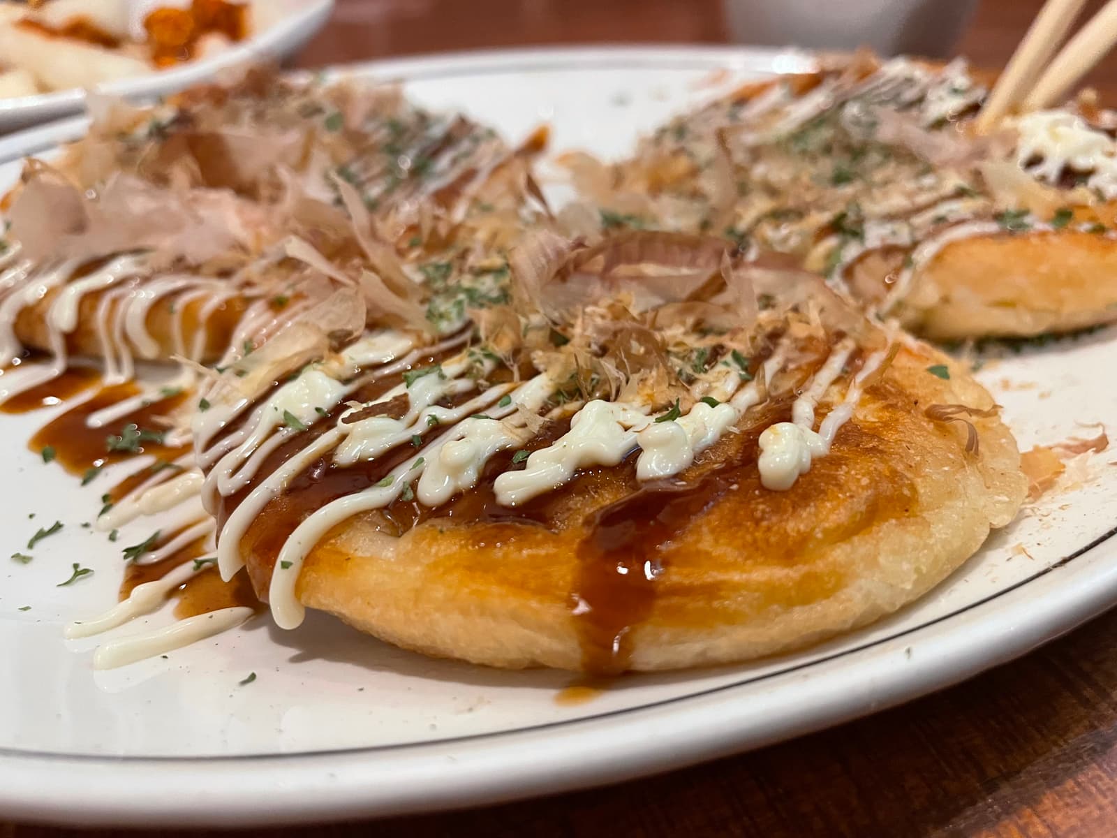 Golden-edged and impossibly tender, Tokyo Ramen’s okonomiyaki delivers a savoury, shrimp-studded start that sets the tone with soul and flavour.